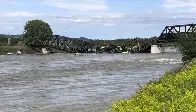 Freight train carrying hazardous materials plunge into Yellowstone River as bridge collapses